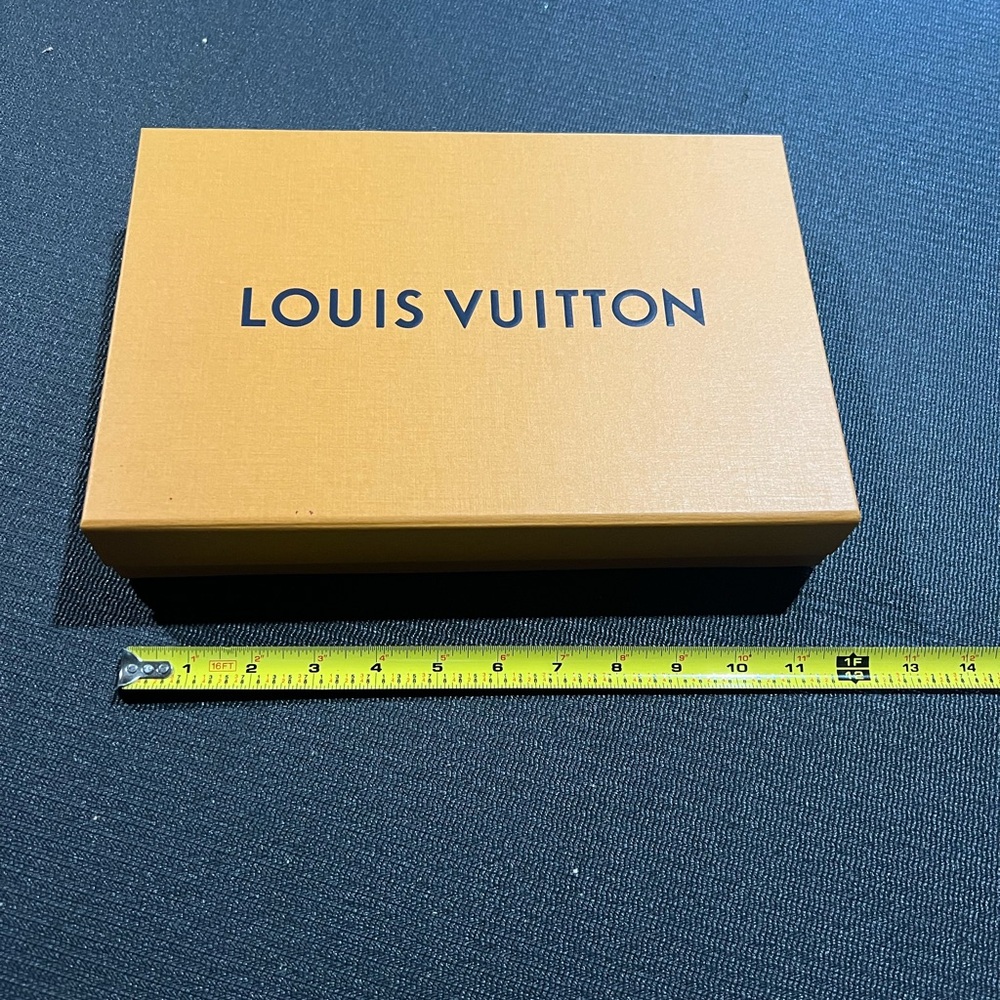 Louis Vuitton orange box, blue ribbon and note card